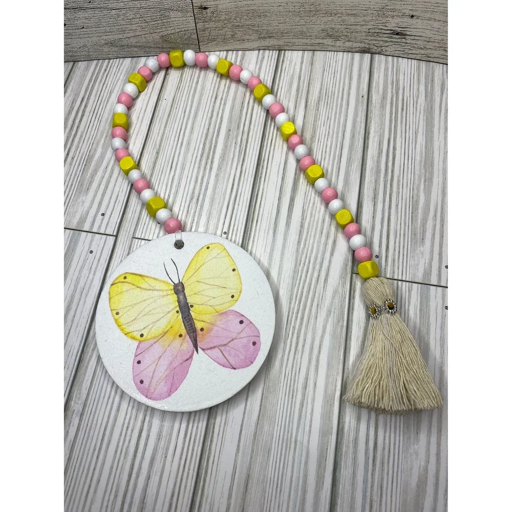 Wooden bead garland with butterfly print in spring tones /wooden spring garlands